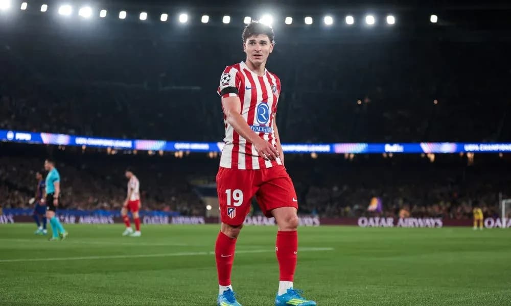 Player in Atlético Madrid kit on the pitch