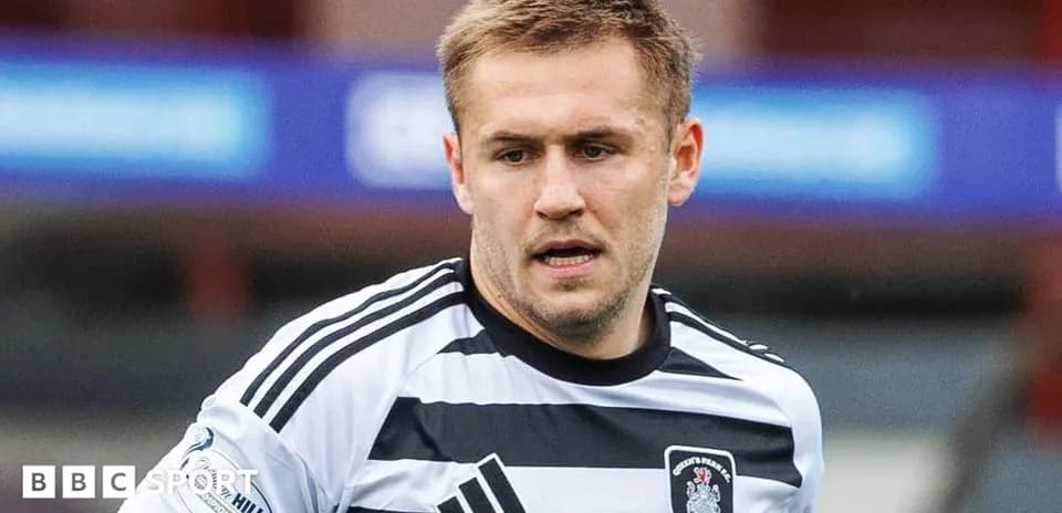 Player in striped jersey during match action