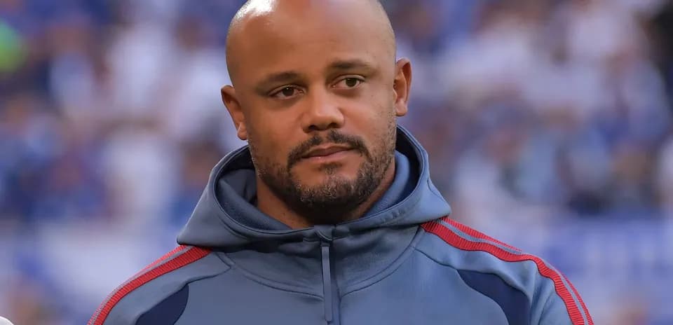 Man in a gray hoodie with team logo