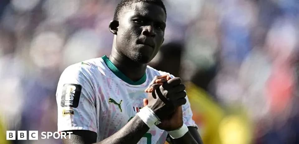 Player in national team jersey during match celebration