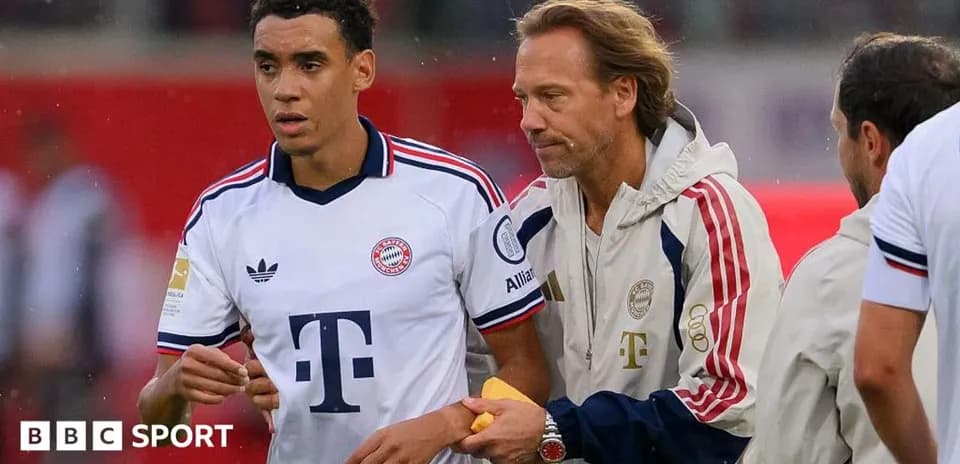 Player receiving instructions from coach on the sidelines