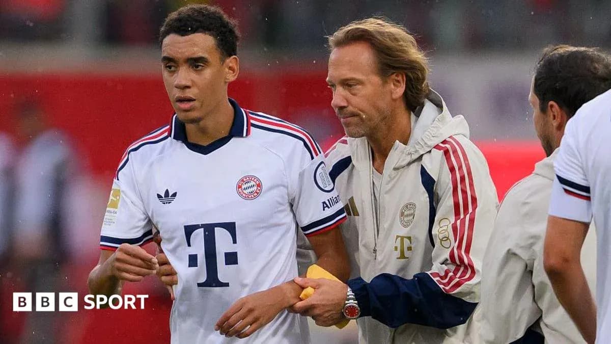 Player receiving instructions from coach on the sidelines