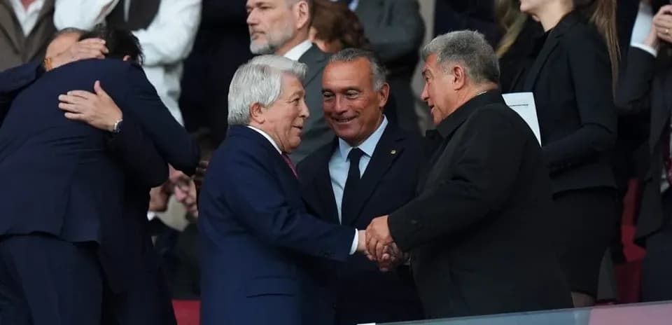 Officials greeting each other in the stands