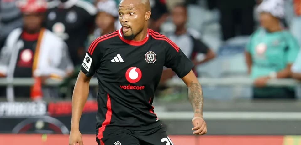 Player in black jersey running during match
