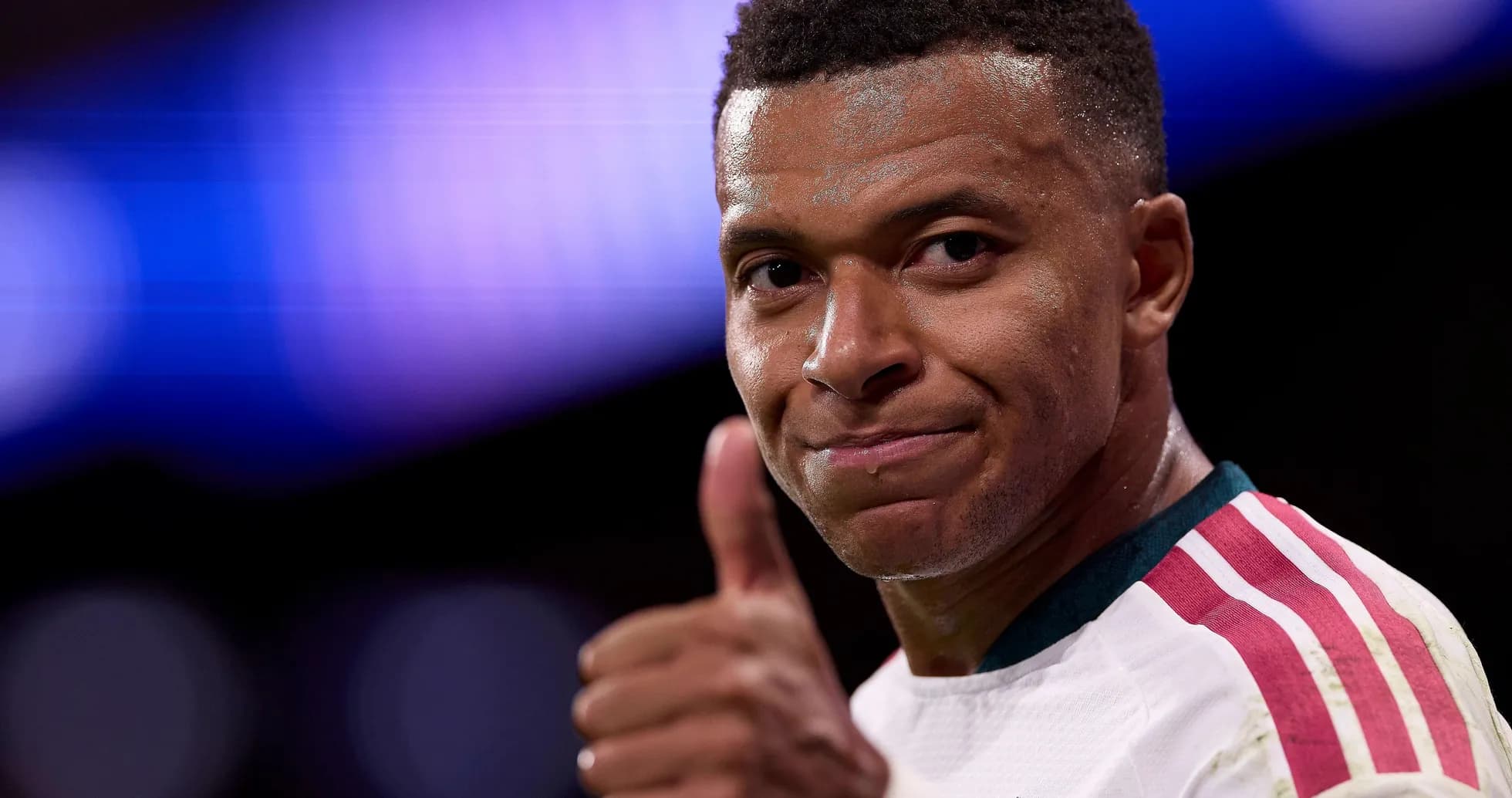 Player giving thumbs up during match celebration