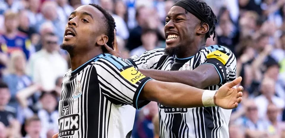 Newcastle players celebrating a goal together