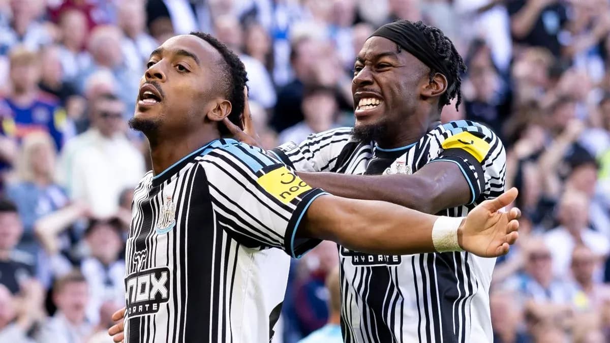 Newcastle players celebrating a goal together