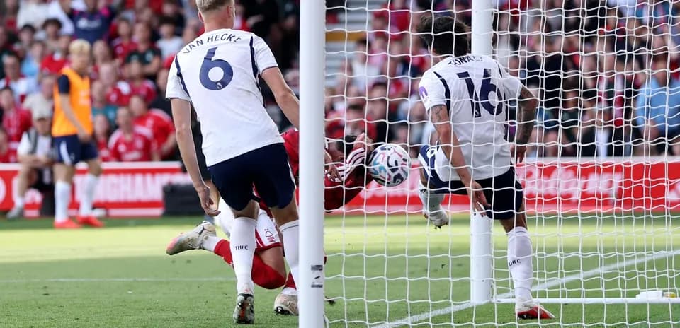 Goalkeeper saves shot during Nottingham Forest match