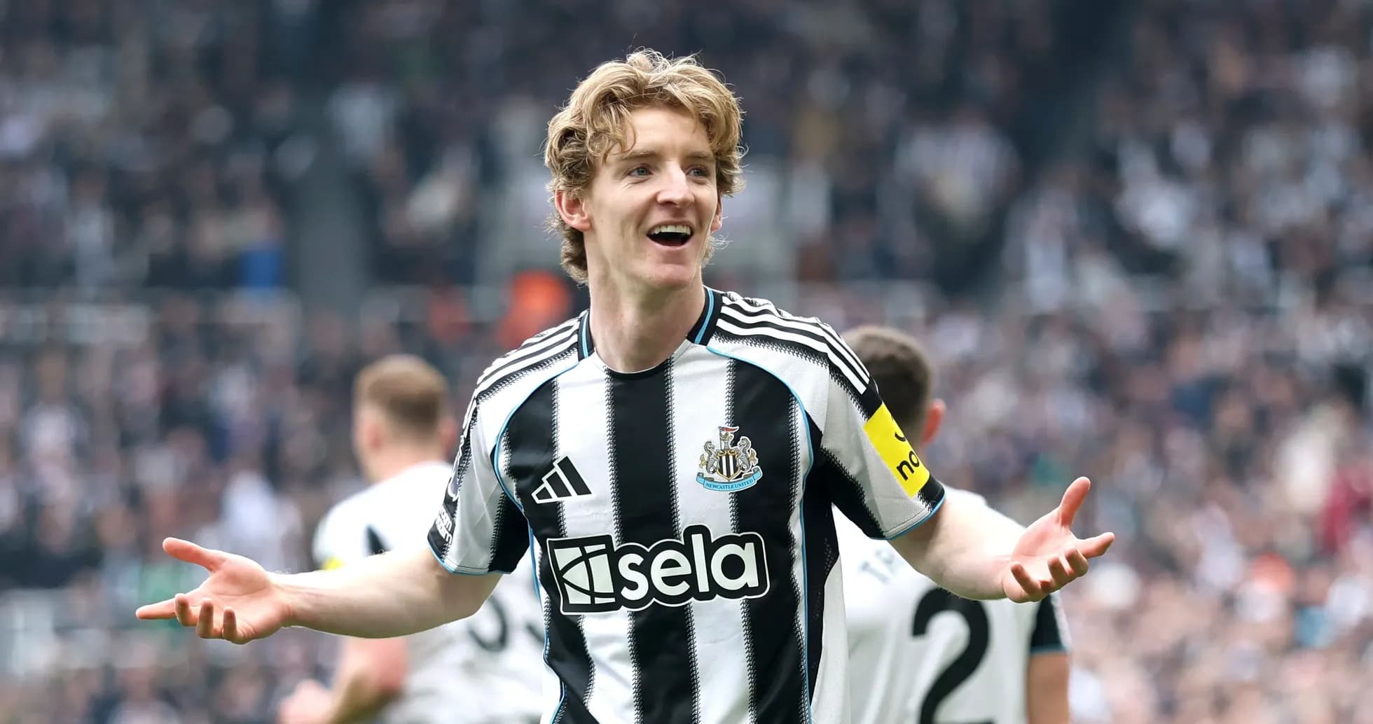 Newcastle player celebrating in front of crowd