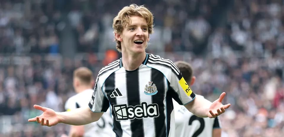 Newcastle player celebrating in front of crowd