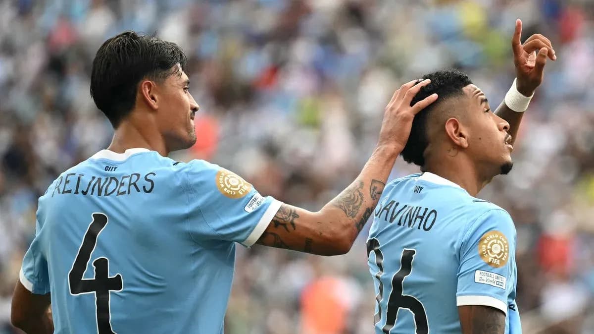 Two players celebrating on the field during match