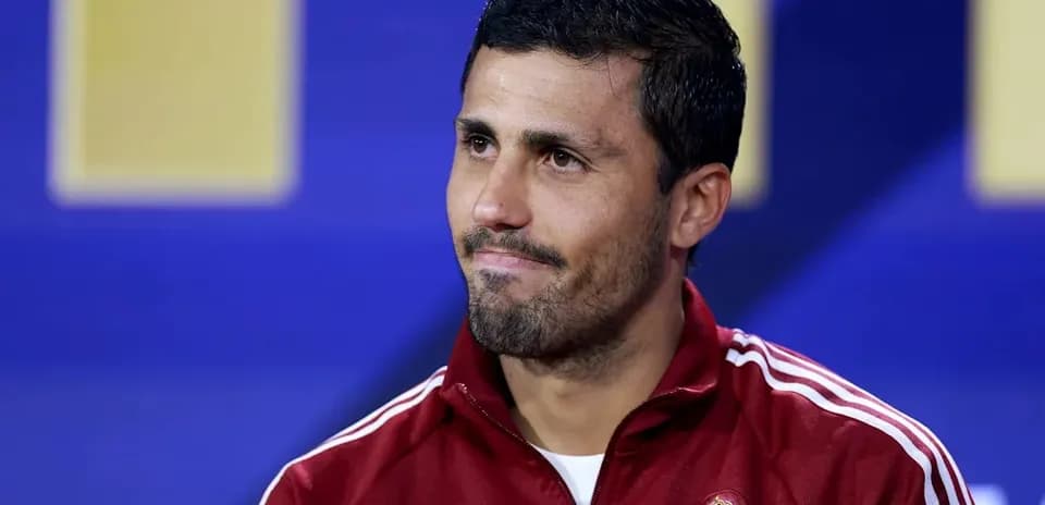 Football player in Spain tracksuit at press conference