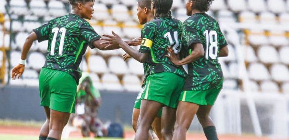 Players celebrating a goal on the pitch