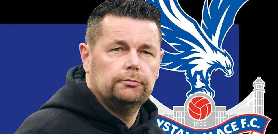 Man in hoodie with Crystal Palace FC logo backdrop