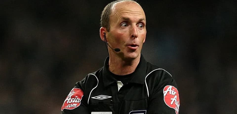 Referee communicating during a football match