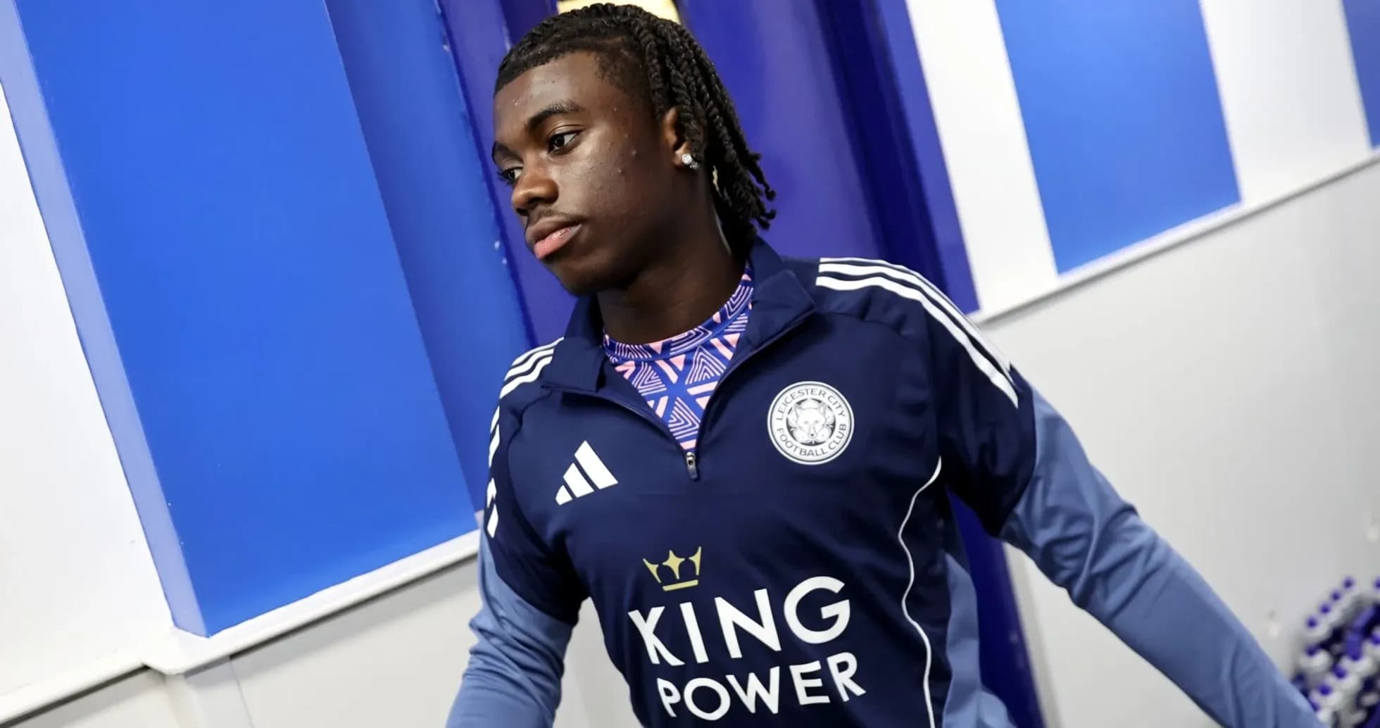Player in Leicester City training gear in hallway