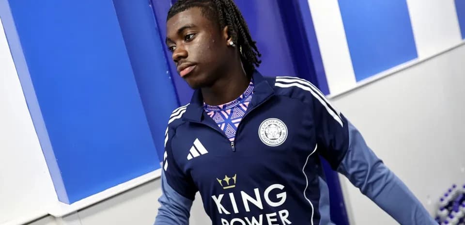 Player in Leicester City training gear in hallway