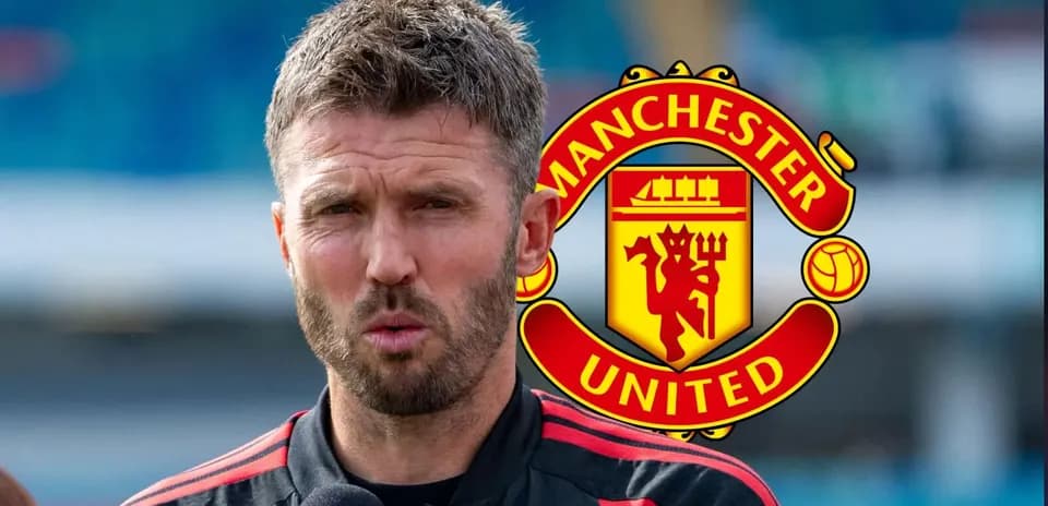 Manager speaking during press conference with Manchester United logo