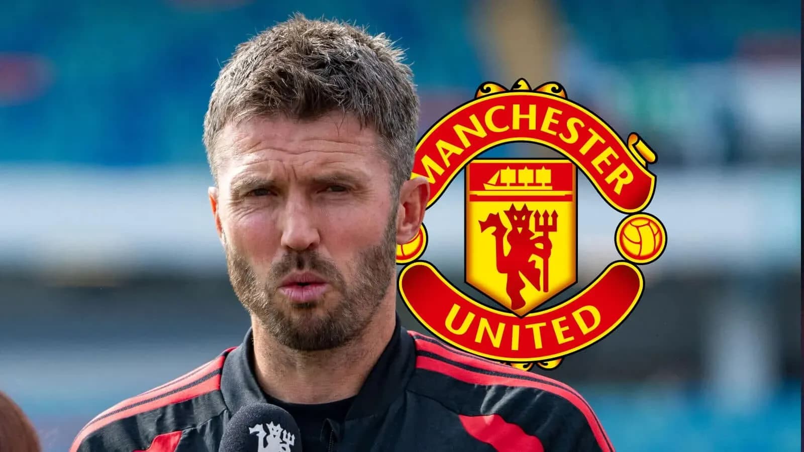 Manager speaking during press conference with Manchester United logo