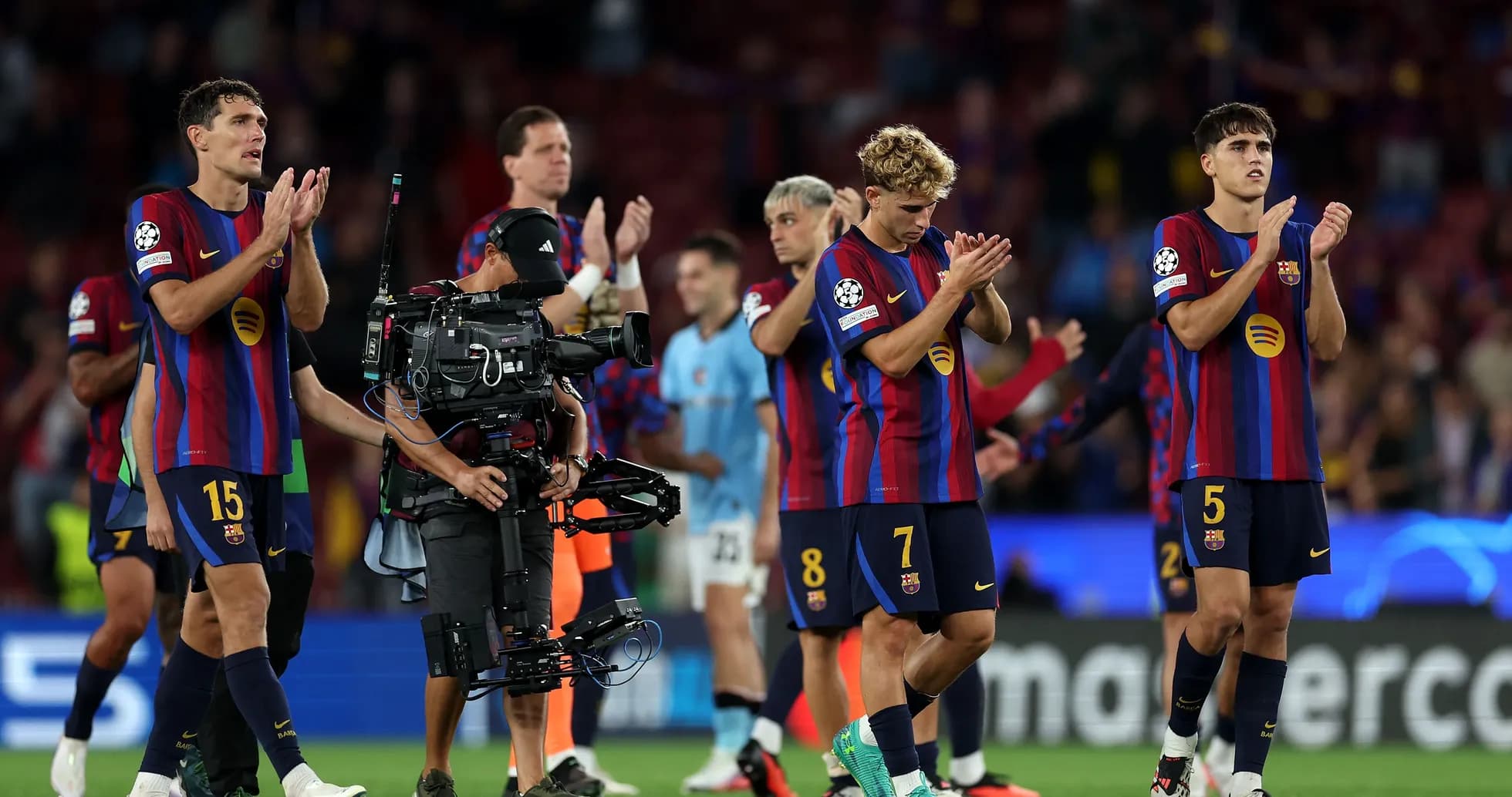 Barcelona players applauding fans after match