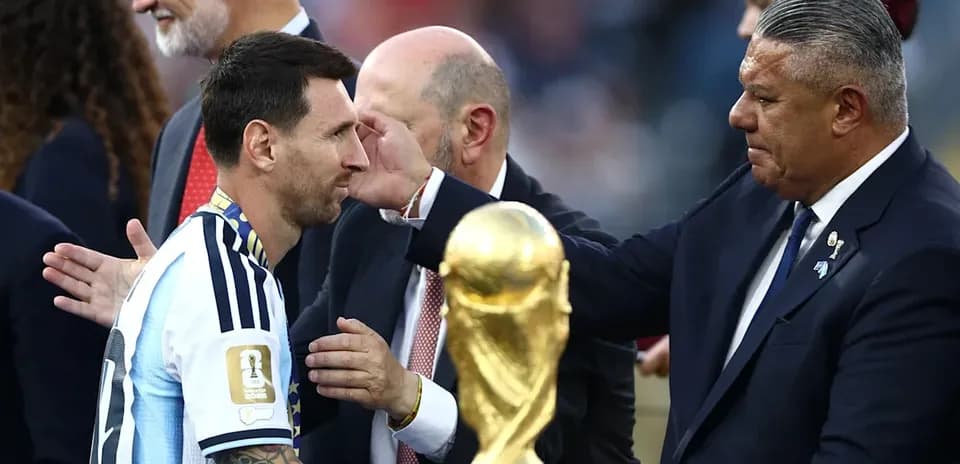 Lionel Messi receiving trophy during award ceremony