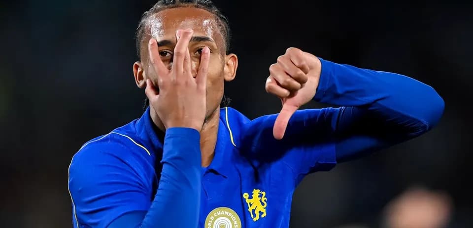 Player gesturing during match celebration in blue kit
