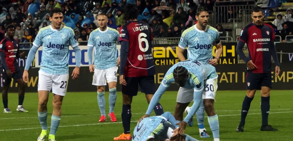 Juventus players attending to an injured teammate
