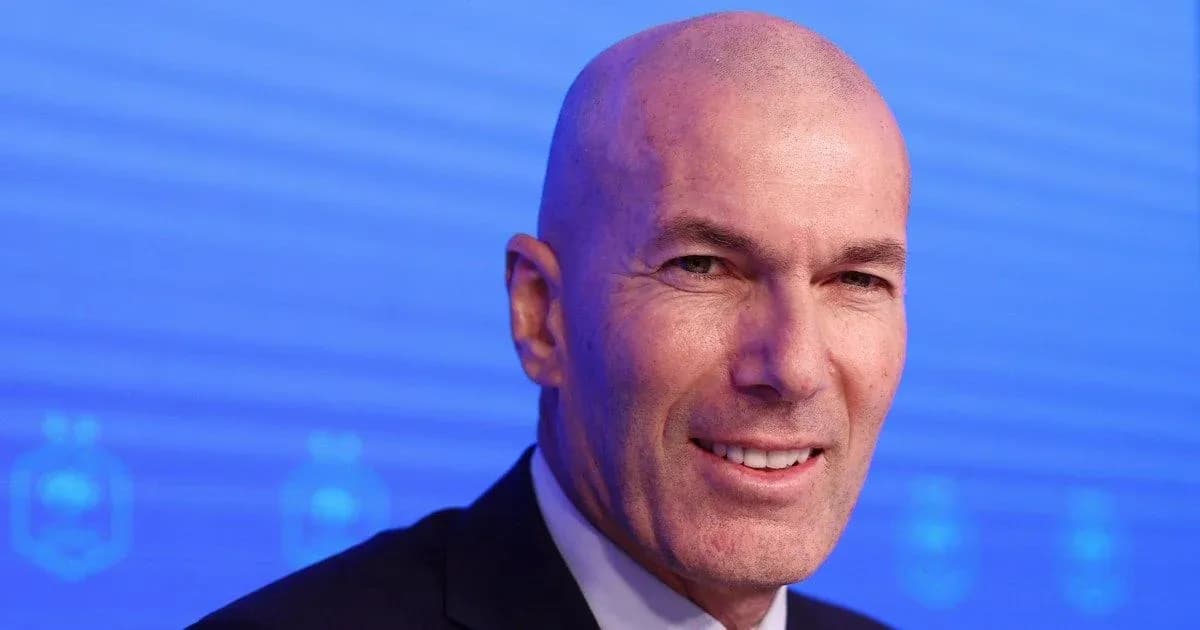 Man smiling during a press conference