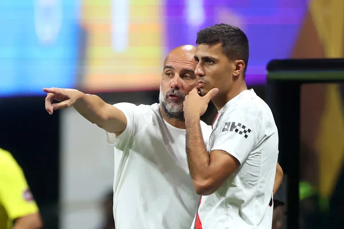 Coach discussing strategy with player on sidelines