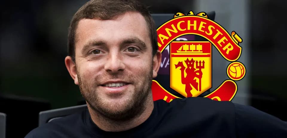 Person smiling with Manchester United logo in background