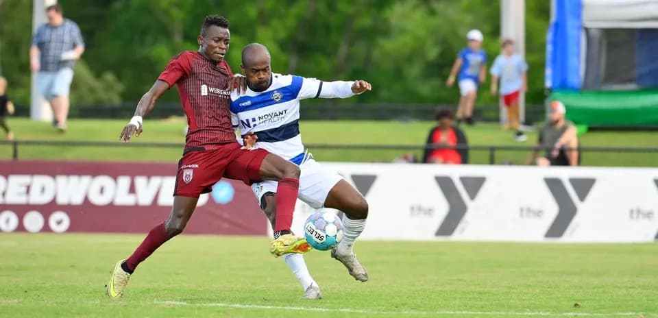 Players contesting the ball during One Knoxville match