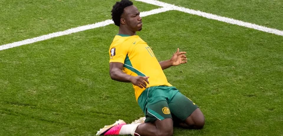 Player celebrating after scoring a goal on pitch