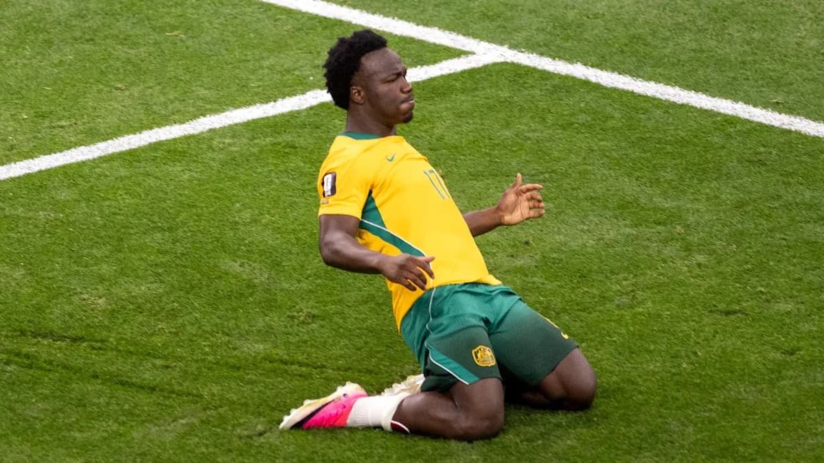 Player celebrating after scoring a goal on pitch