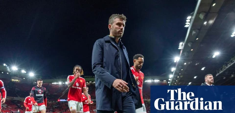 Manchester United players walking off the pitch