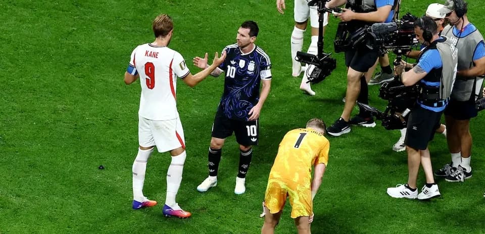 Kane and Messi interacting during match