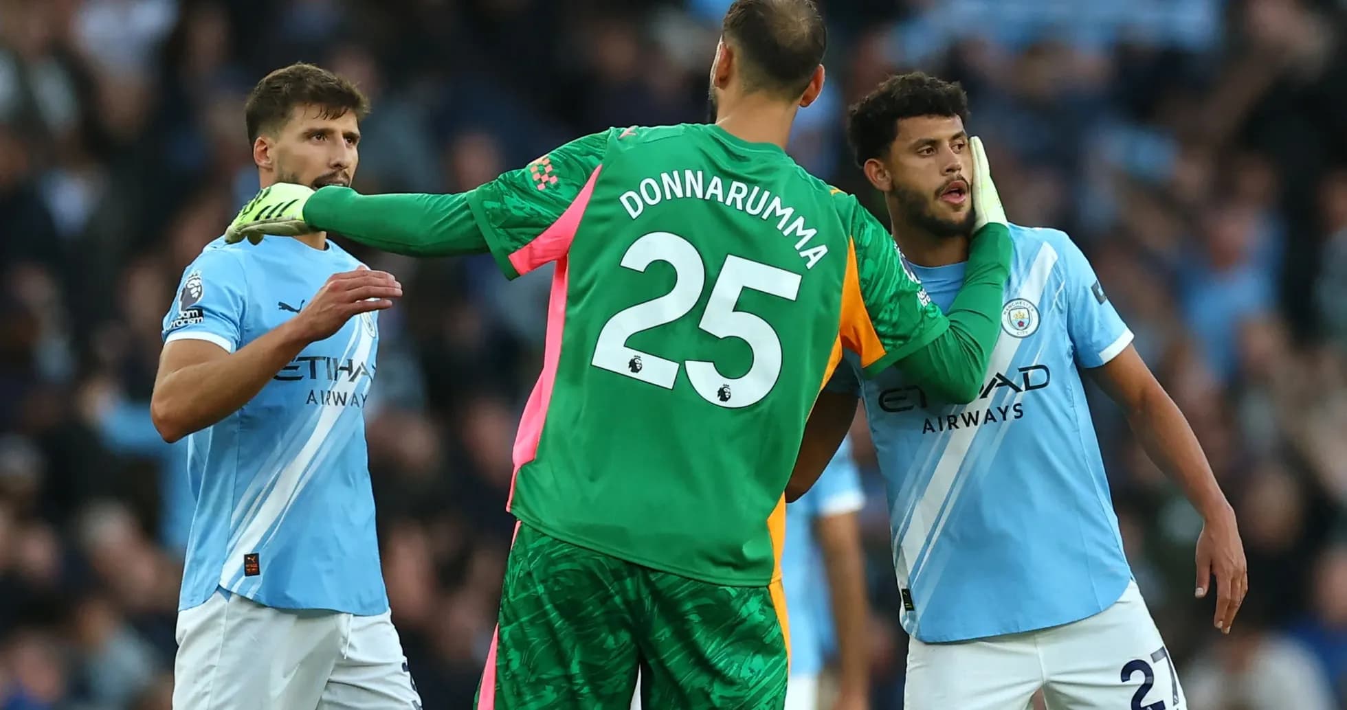 Players discussing during Manchester City match