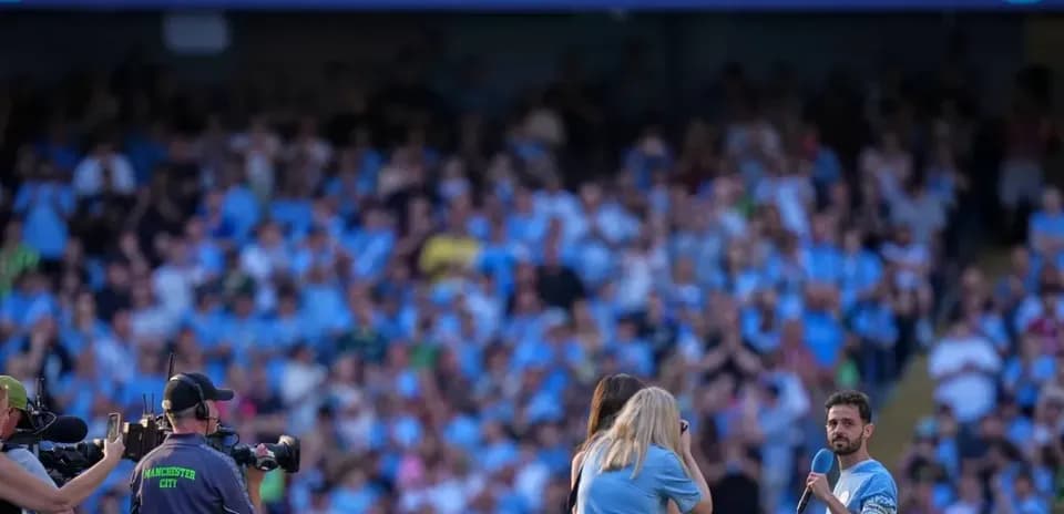 Player speaking to crowd during farewell event