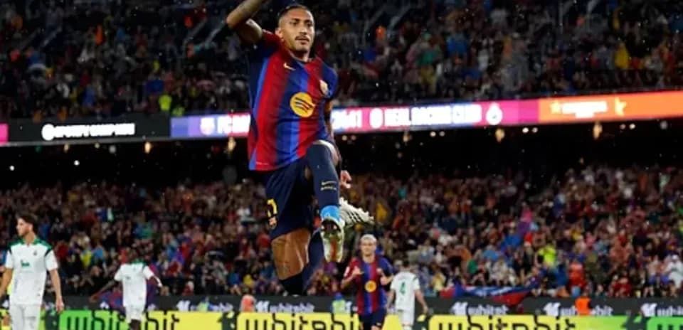 Player celebrating after scoring a goal for Barcelona