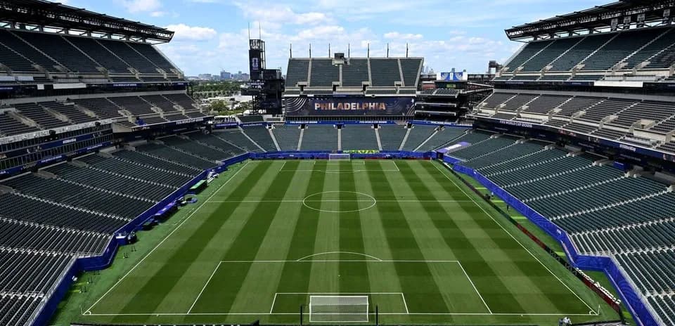 Empty stadium with soccer field and seats