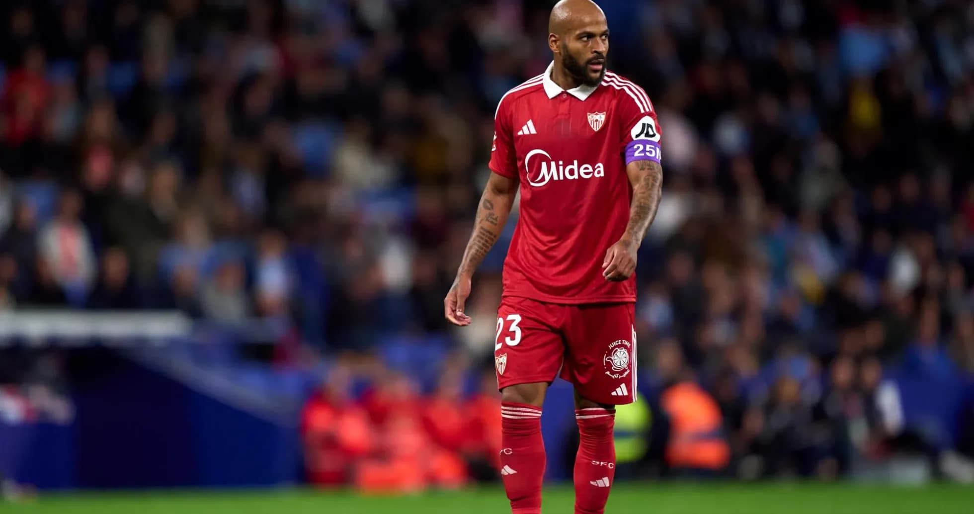 Sevilla player walking on the pitch during match