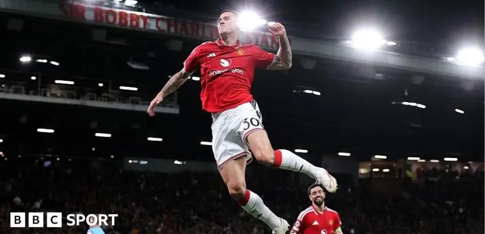 Manchester United player celebrating a goal at Old Trafford