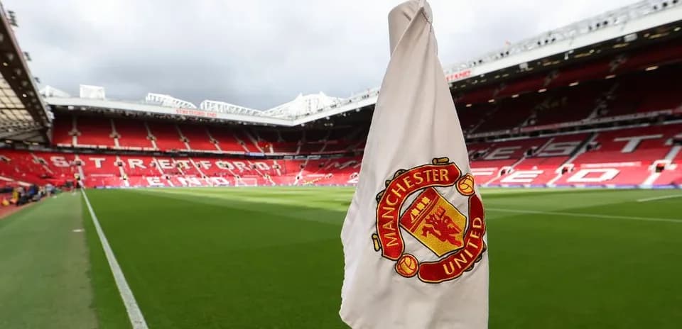 Corner flag with Manchester United emblem at stadium