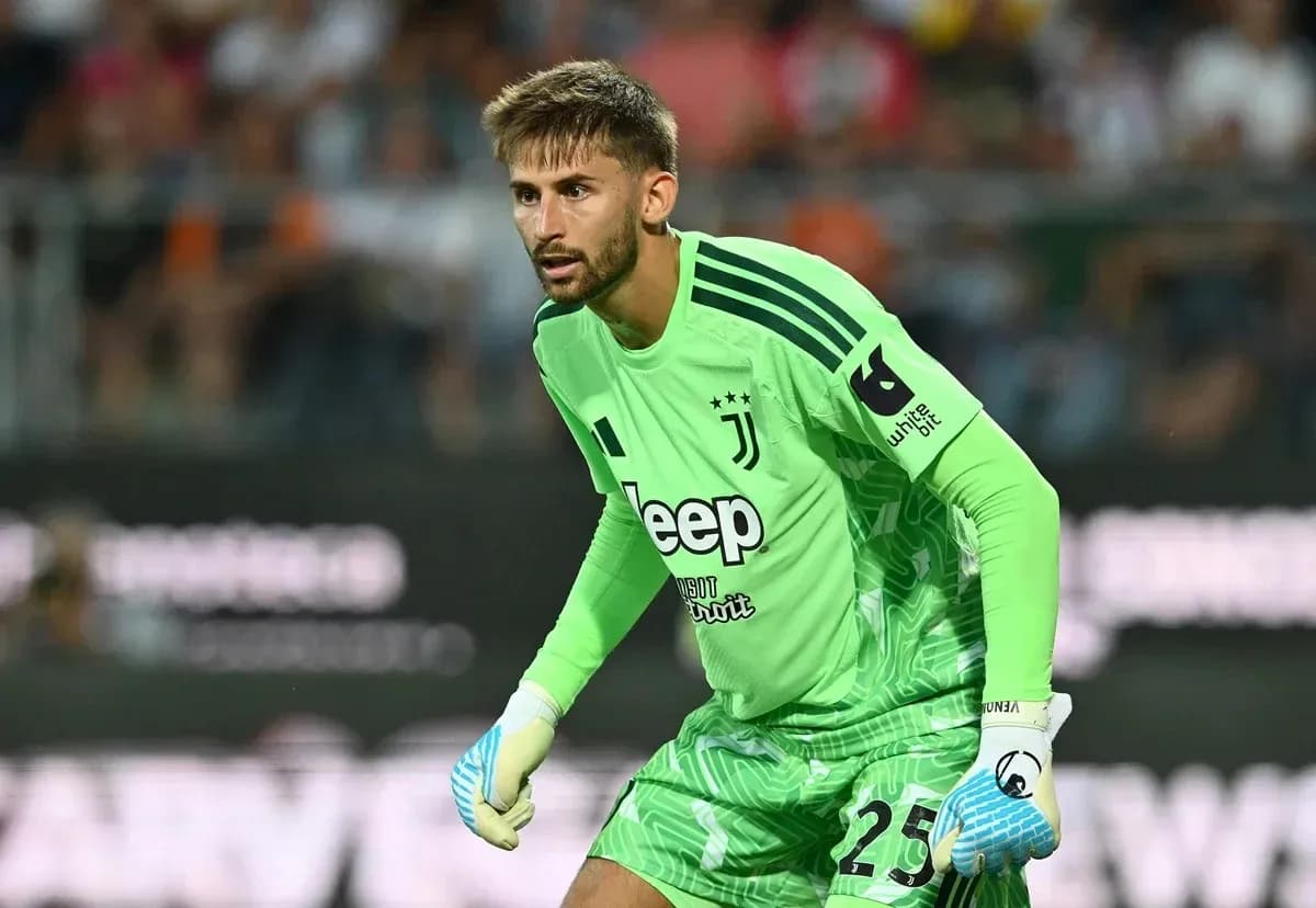 Goalkeeper in green jersey preparing for play