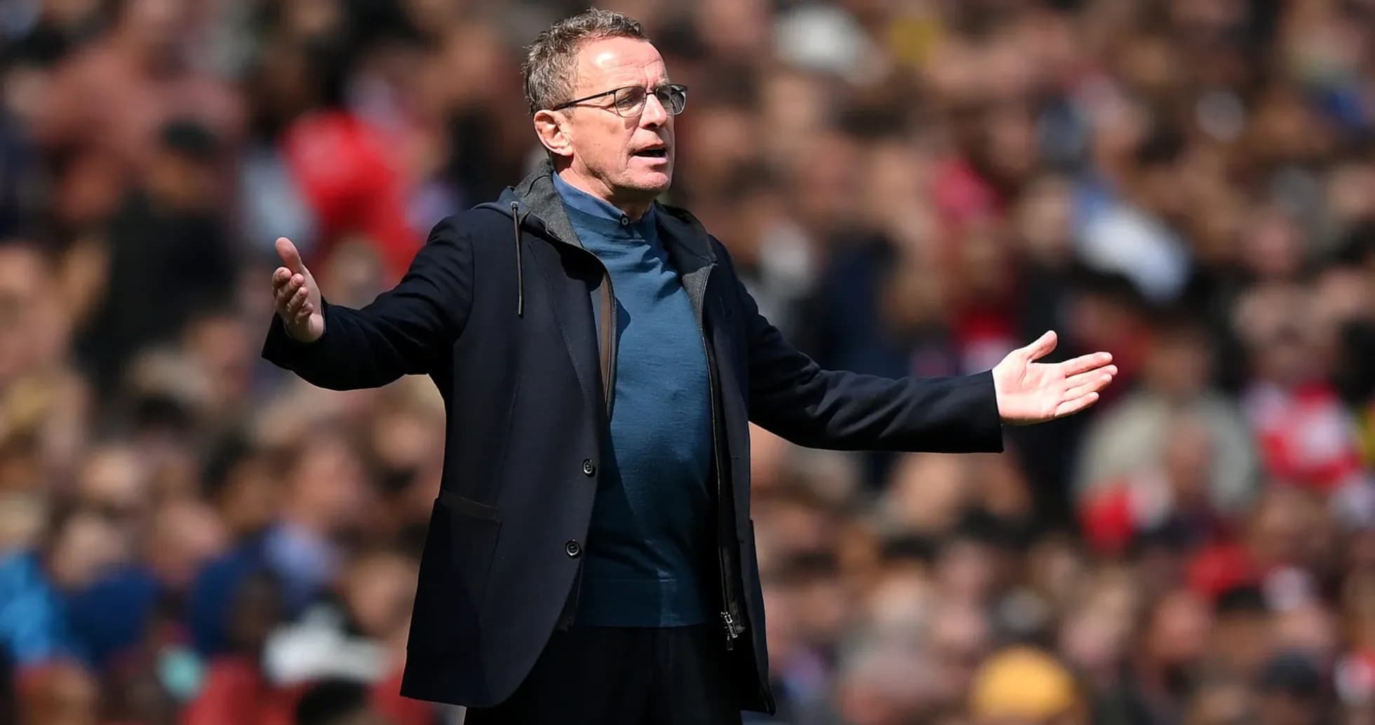 Coach gesturing during match on the sidelines