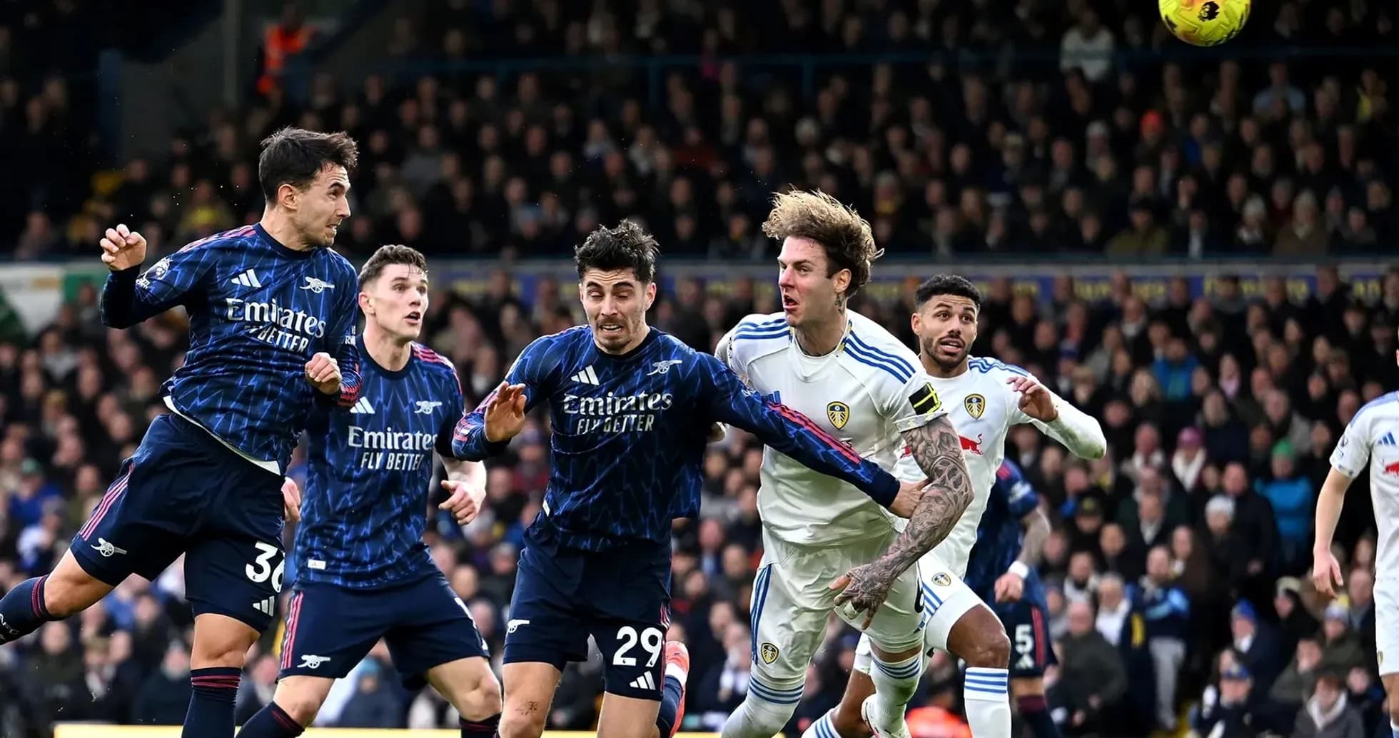 Arsenal players competing against Leeds during match