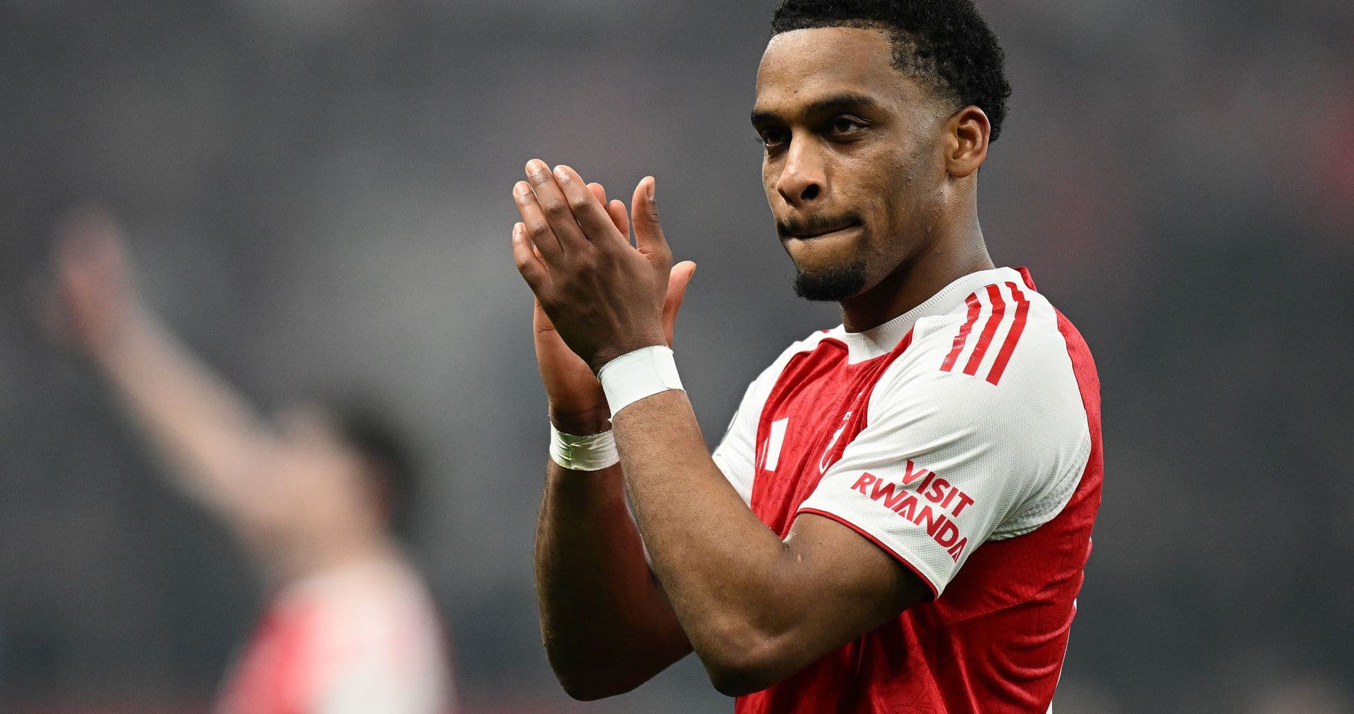 Player applauding fans after a match