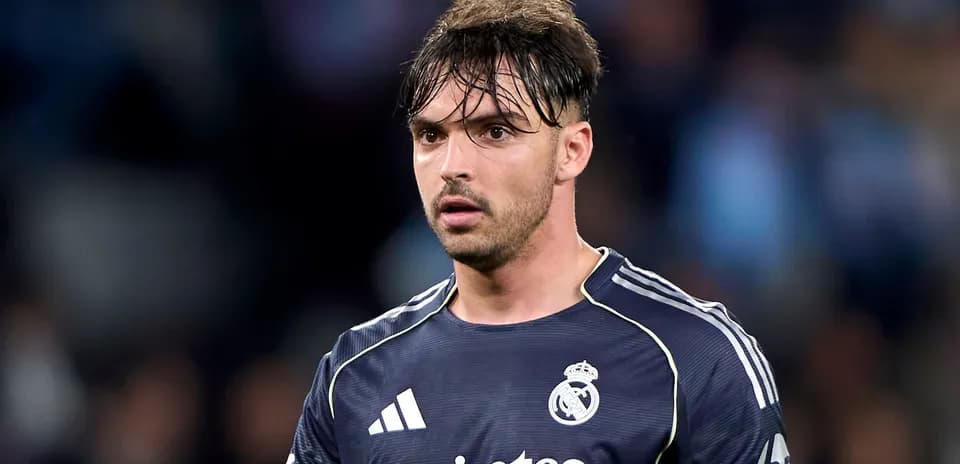 Goalkeeper wearing Real Madrid kit on field