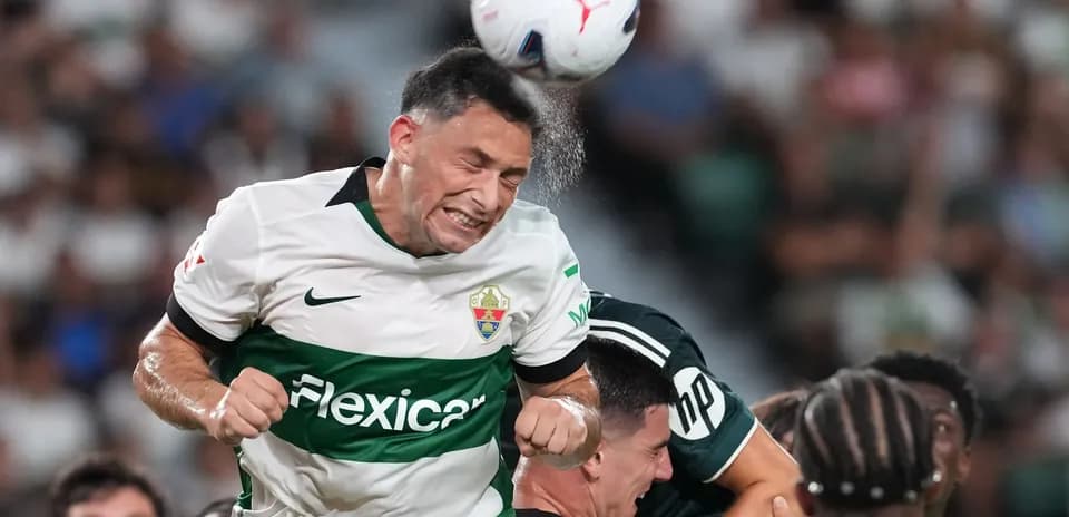 Player heading the ball during match action