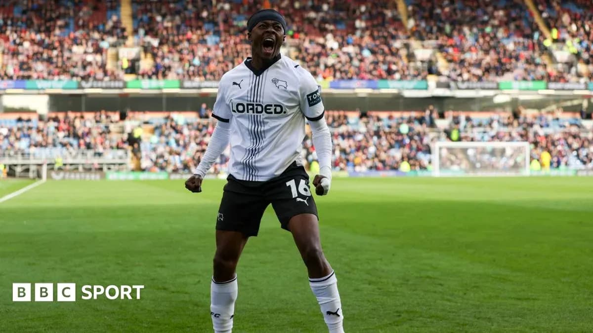 Player celebrating a goal on the pitch Player celebrating a goal on the pitch