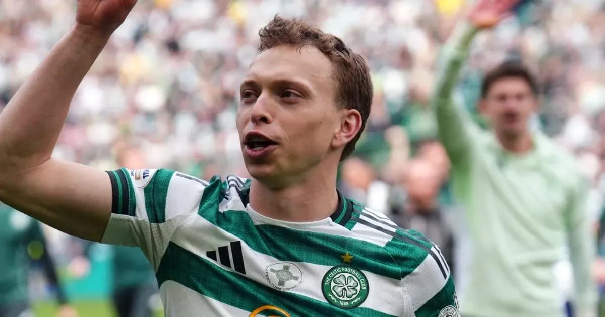 Celtic player celebrating with fans at stadium Celtic player celebrating with fans at stadium